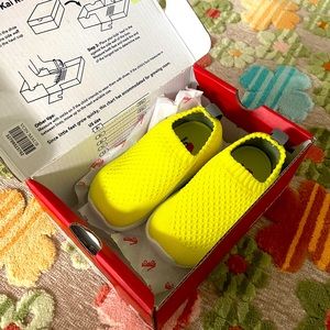 Kids shoes.  See Kai Run Neon Yellow Ryder Knit Shoes